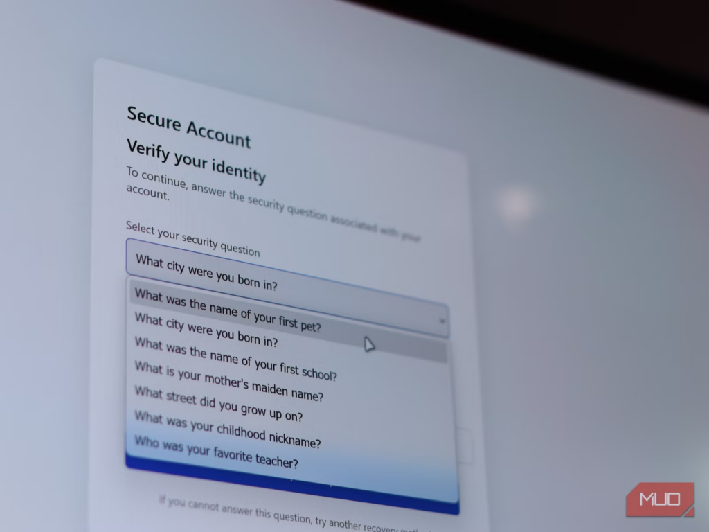 Computer screen displaying a secure account identity verification page with security questions for account recovery.